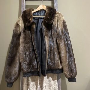 Men’s fur and leather jacket with a few imperfections pictured on the leather.